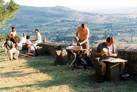 An afternoon workshop at Cortona Week, hands shaping material under a professional artist’s guidance.